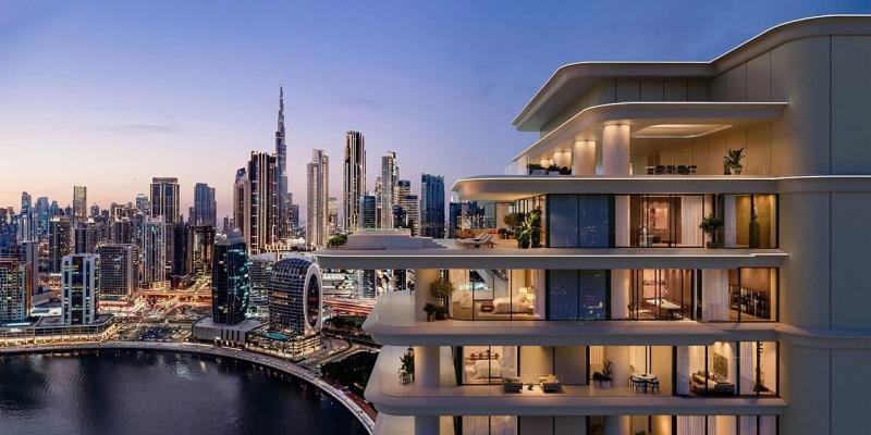 Modern residential building with Dubai skyline – upcoming Enaam Properties development